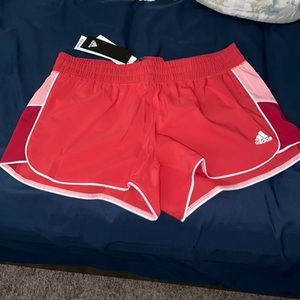 red adidas shorts